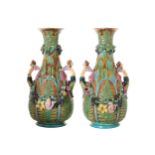 PAIR OF LARGE NINETEENTH-CENTURY MAJOLICA JARDINIERES each of baluster form, with raised floral swag