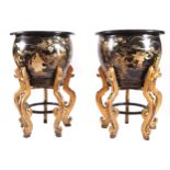 PAIR OF LARGE CHINESE LACQUERED PAPIER MÂCHÉ URNS each supported on a gilt wood stand 92 cm. high;