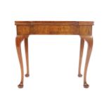 GEORGE II STYLE WALNUT GAMES TABLE the rectangular top with projecting square eared corners to the