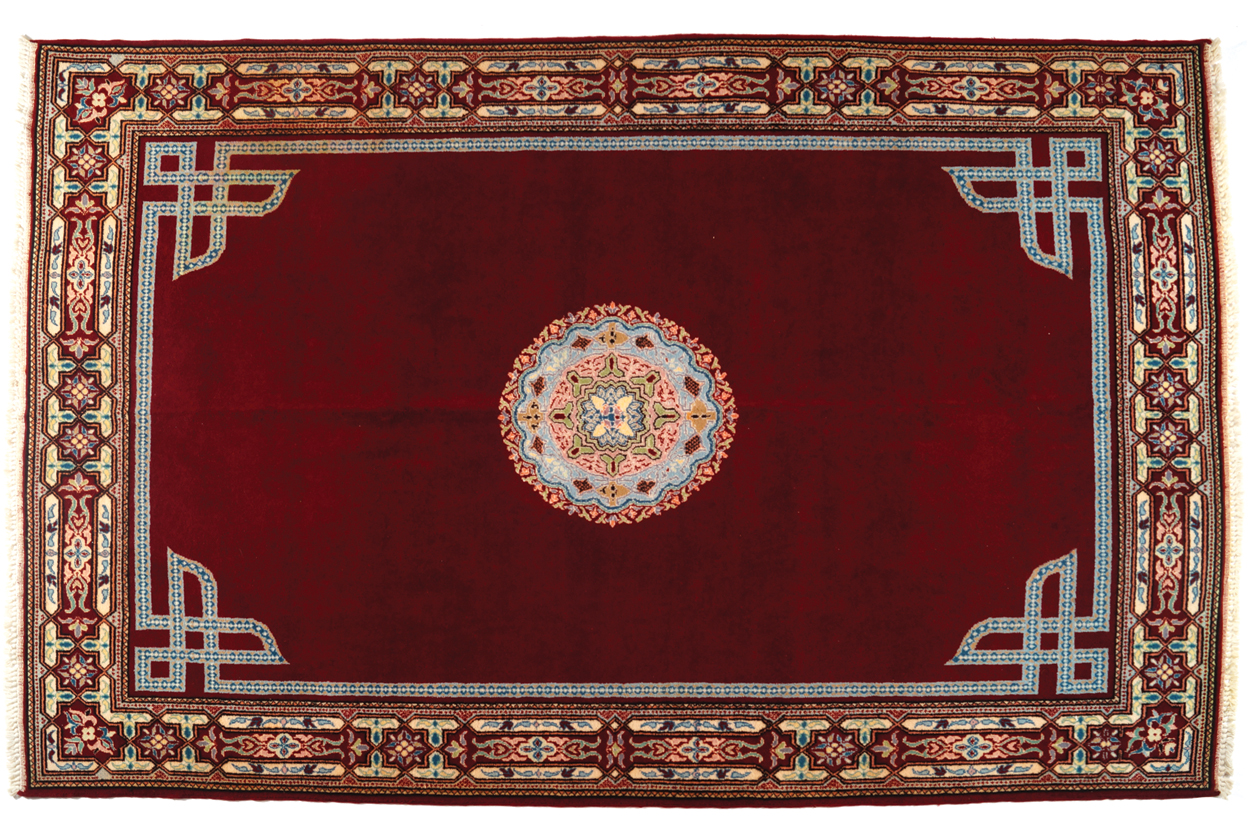 MOROCCAN BERBER CARPET, CIRCA 1940 on red ground with central medallion 196 x 296 cm. Worldwide