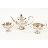 THREE PIECE SILVER TEA SERVICE Each of circular chalice form with embossed Celtic decoration. Dublin