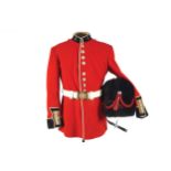 IRISH GUARDS TUNIC AND BELT and associated busby, accompanied documentation commemorating L. Srg.