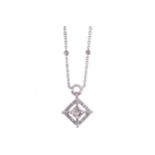 18 CT. WHITE GOLD CHAIN set with six diamonds and a radiant square cut diamond hanging from it,