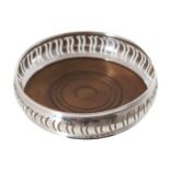 LARGE DECORATIVE STERLING SILVER CHAMPAGNE WINE COASTER London, Maker: DJ over S 13 cm. diameter