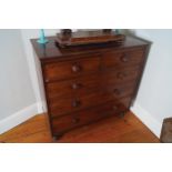 REGENCY PERIOD MAHOGANY CHEST of two short and three long drawers, furnished with turned knobs,