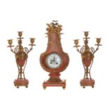 NINETEENTH-CENTURY ORMOLU MOUNTED PINK MARBLE CLOCK GARNITURE Clock: 46 cm. high (1); Candelabra: 38