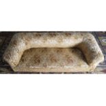 NINETEENTH-CENTURY UPHOLSTERED ROLL BACK CHESTERFIELD SETTEE raised on turned legs to the fore,
