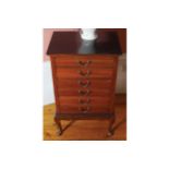 EDWARDIAN MAHOGANY MUSIC CHEST of 5 drawers, raised on cabriole legs 53 cm. wide; 39 cm. deep; 86