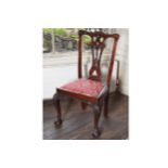 SET OF FOUR CHIPPENDALE STYLE DINING CHAIRS each with a serpentine crest rail, above a pierced