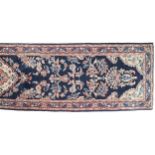 WEST PERSIAN MAHAL RUNNER indigo field, vines and flower heads, red border 413 x 86 cm.