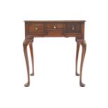 EARLY TWENTIETH-CENTURY WALNUT LOWBOY the rectangular top above a series of drawers, furnished