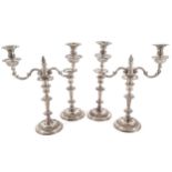 A SET FOUR IRISH SILVER CANDLESTICKS AND TWO IRISH SILVER CANDELABRA BRANCHES, DUBLIN, CIRCA 1740