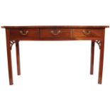 GEORGE III PERIOD MAHOGANY SIDE TABLE the rectangular form with a serpentine front, above a series