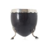 EIGHTEENTH-CENTURY SILVER MOUNTED COCONUT CUP raised on scallop shell headed cabriole legs,