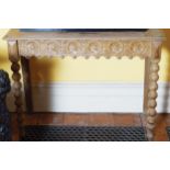 NINETEENTH-CENTURY CARVED OAK HALL TABLE the rectangular top below a floral carved back, above a