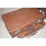 TWO LEATHER TRAVELLING CASES Each with initials L.L. (L. Lefroy, Loughton)