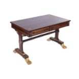 REGENCY PERIOD ROSEWOOD BRASS INLAID AND PARCEL GILT LIBRARY TABLE the rectangular top above two