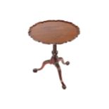 EIGHTEENTH-CENTURY MAHOGANY WINE TABLE the circular pie crust edged raised on a spiral turned stem