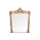 WILLIAM IV GILT-FRAMED OVER-MANTLE MIRROR the rectangular plate with a serpentine top, within a