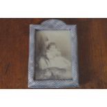 SILVER PHOTO FRAME, CIRCA 1900 with gadrooned, embossed decoration, Birmingham 19 x 13 cm.