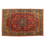 NORTHWEST PERSIAN SILK AND WOOL RUG, CIRCA 1920 red ground, central medallion, turqoise border 134 x