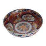 NINETEENTH-CENTURY JAPANESE IMARI BOWL decorated with exotic blossoms, interspersed with figural