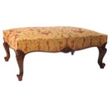 LARGE MAHOGANY AND UPHOLSTERED STOOL of rectangular form, raised on cabriole legs, terminating on