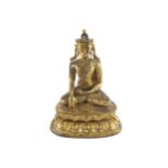 LATE MING PERIOD GILT BRONZE BUDDHA seated in vajrasana on a double-lotus base 38 cm. high; 30 cm.