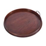 GEORGIAN MAHOGANY SERVING TRAY of circular form furnished with brass handles 50 cm. diameter