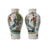 PAIR OF CHINESE FAMILLE VERTE BALUSTER-SHAPED VASES decorated with court ladies and their