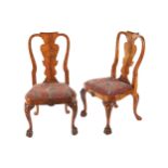 PAIR OF IRISH GEORGE I STYLE WALNUT SIDE CHAIRS each with a raised armorial shaped back above a