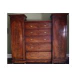 WILLIAM IV PERIOD MAHOGANY INVERTED BREAKFRONT WARDROBE the central chest of five long drawers,