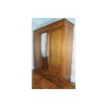 NINETEENTH-CENTURY AESTHETIC REVIVAL PINE THREE DOOR WARDROBE with central mirror door 186 cm. wide;