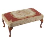 EDWARDIAN AUBUSSON UPHOLSTERED STOOL raised on cabriole legs, terminating on pad feet 40 cm. high;