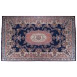 PERSIAN CARPET blue ground, red and tuqoise border, oval centre 245 x 345 cm.