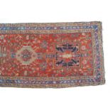 LONG PERSIAN HERIZ RUNNER red ground with five medallions 304 x 92 cm.