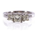 14 CT. WHITE GOLD MOUNTED RING set with three princess cut diamonds weighing 1.07 ct.