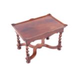 EDWARDIAN WALNUT COFFEE TABLE the rectangular tray top, above a conforming frieze, raised on pierced