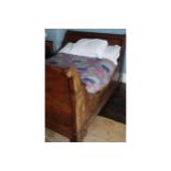 FRENCH EMPIRE BRASS MOUNTED SLEIGH BED 144 cm. wide