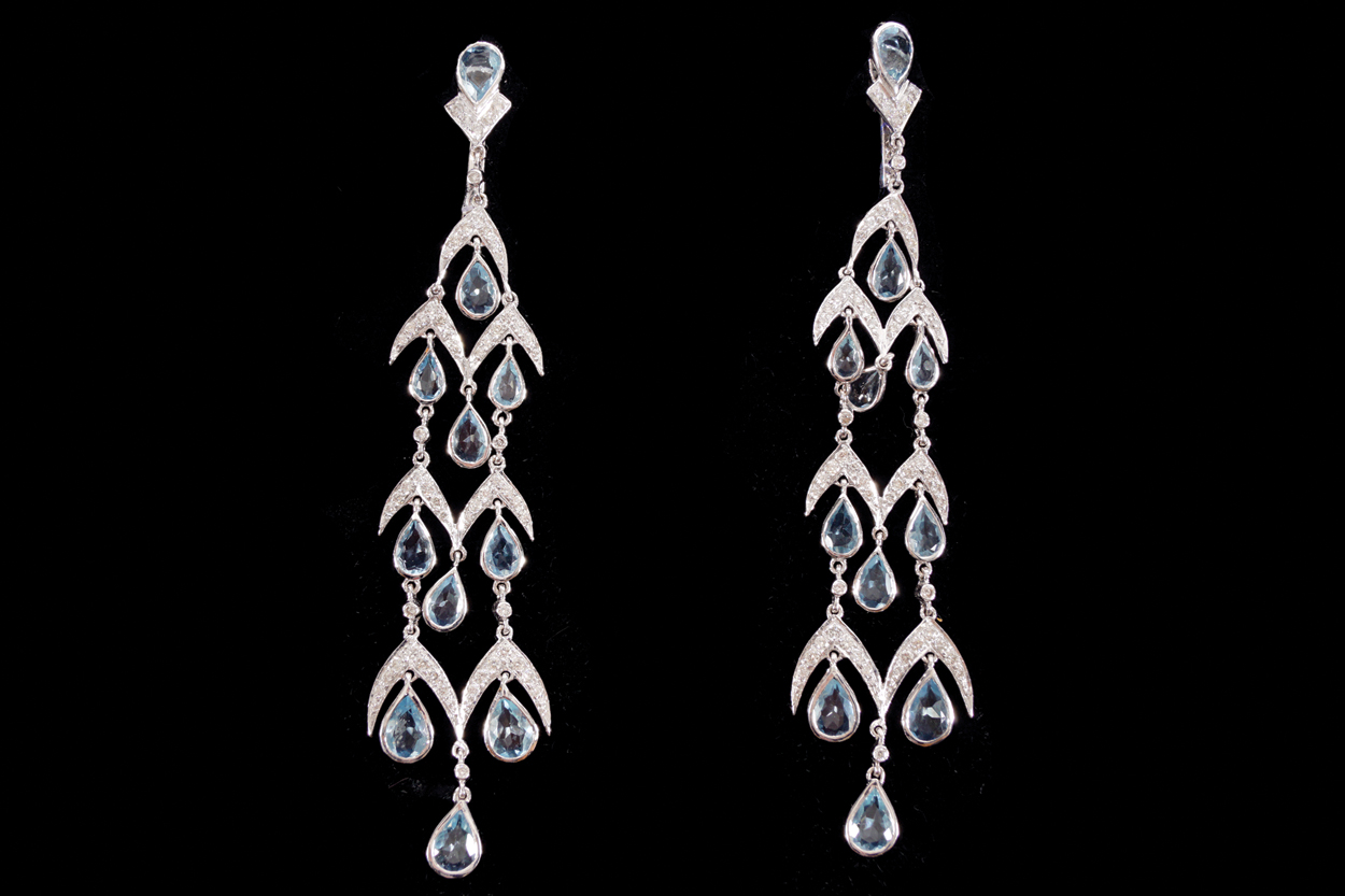 LONG PAIR OF WHITE GOLD EARRINGS set with pear shaped aquamarines and round brilliant cut diamonds