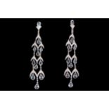 LONG PAIR OF WHITE GOLD EARRINGS set with pear shaped aquamarines and round brilliant cut diamonds