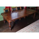 VICTORIAN MAHOGANY TELESCOPIC DINING TABLE the rectangular top with rounded corners, raised on