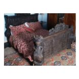 MAGNIFICENT NINETEENTH-CENTURY CARVED OAK FRAMED MARRIAGE BED with profuse figure carved panels,