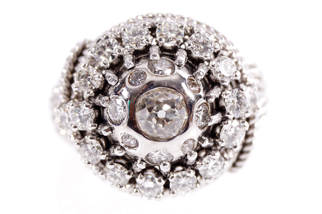 PLATINUM AND 18 CT. WHITE GOLD CLUSTER COCKTAIL RING set with round brilliant cut diamonds