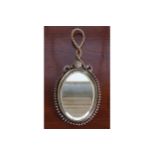 NINETEENTH-CENTURY BRASS FRAMED HAND HELD VANITY MIRROR 26 cm. high