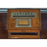 NINETEENTH-CENTURY OAK AND BRASS BOUND LETTER BOX the sloped lid inscribed LETTERS, with a letter