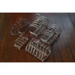 GROUP OF SIX SILVER PLATED TOAST RACKS