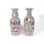 PAIR OF CHINESE FAMILLE ROSE VASES damaged 64 cm. high