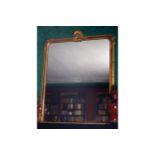 LARGE NINETEENTH-CENTURY CARVED GILT WOOD FRAMED OVER MANTLE MIRROR the rectangular plate with