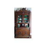 CARVED NINETEENTH-CENTURY OAK BOOKCASE the superstructure with an egg and dart moulded crown,